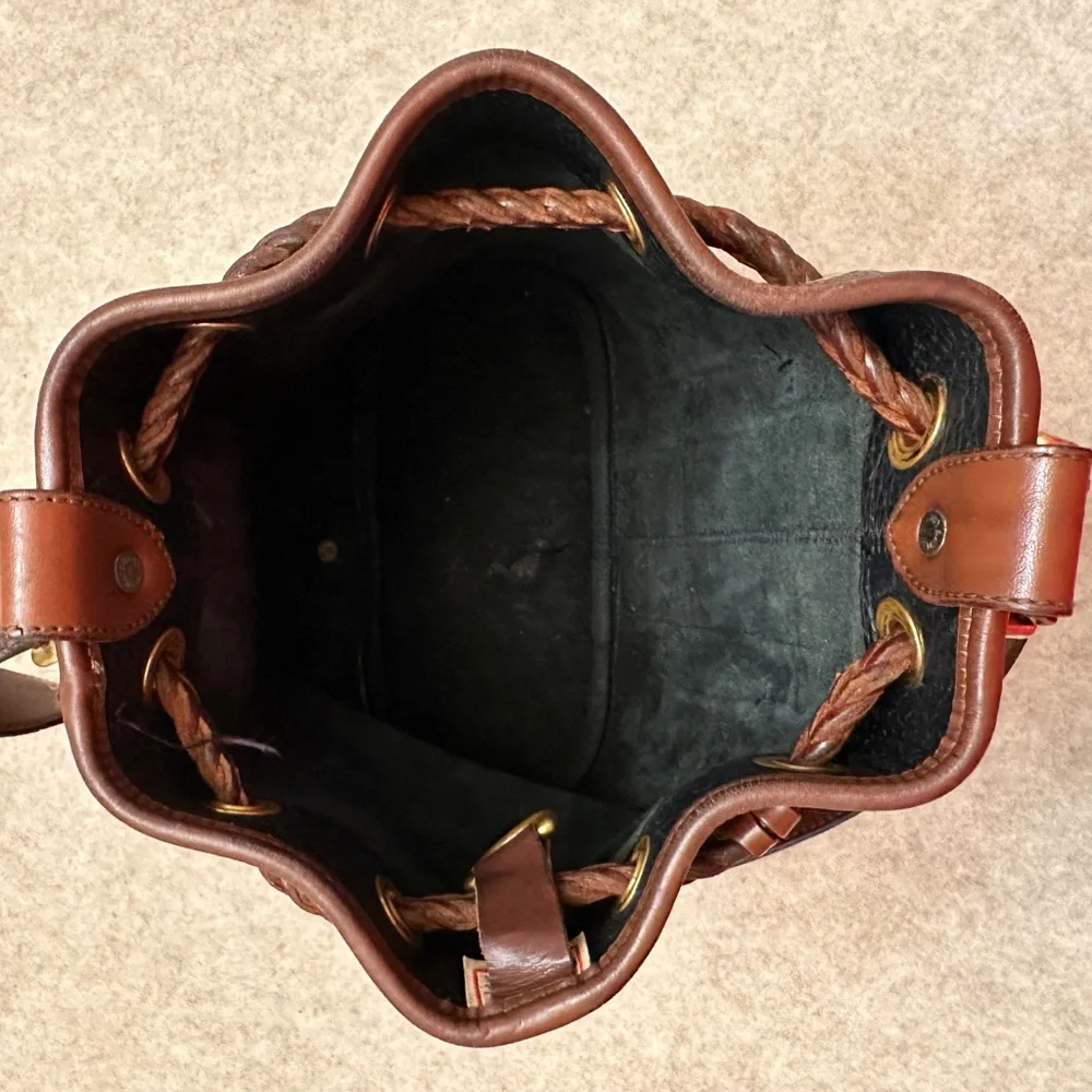 Vintage Dooney & Bourke Black w/Brown All Weather Leather Sling Small Backpack